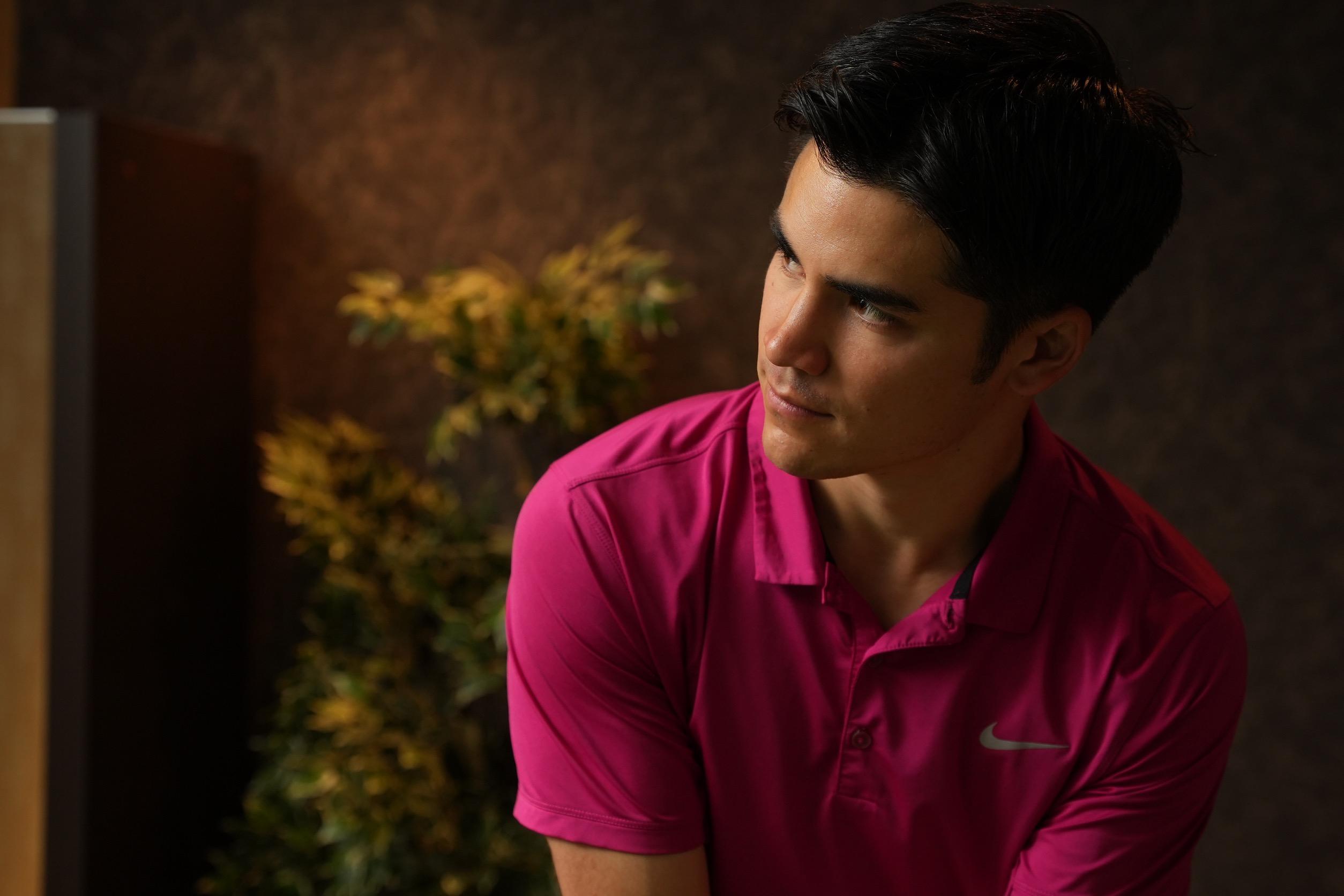 Studio portrait in Nike polo